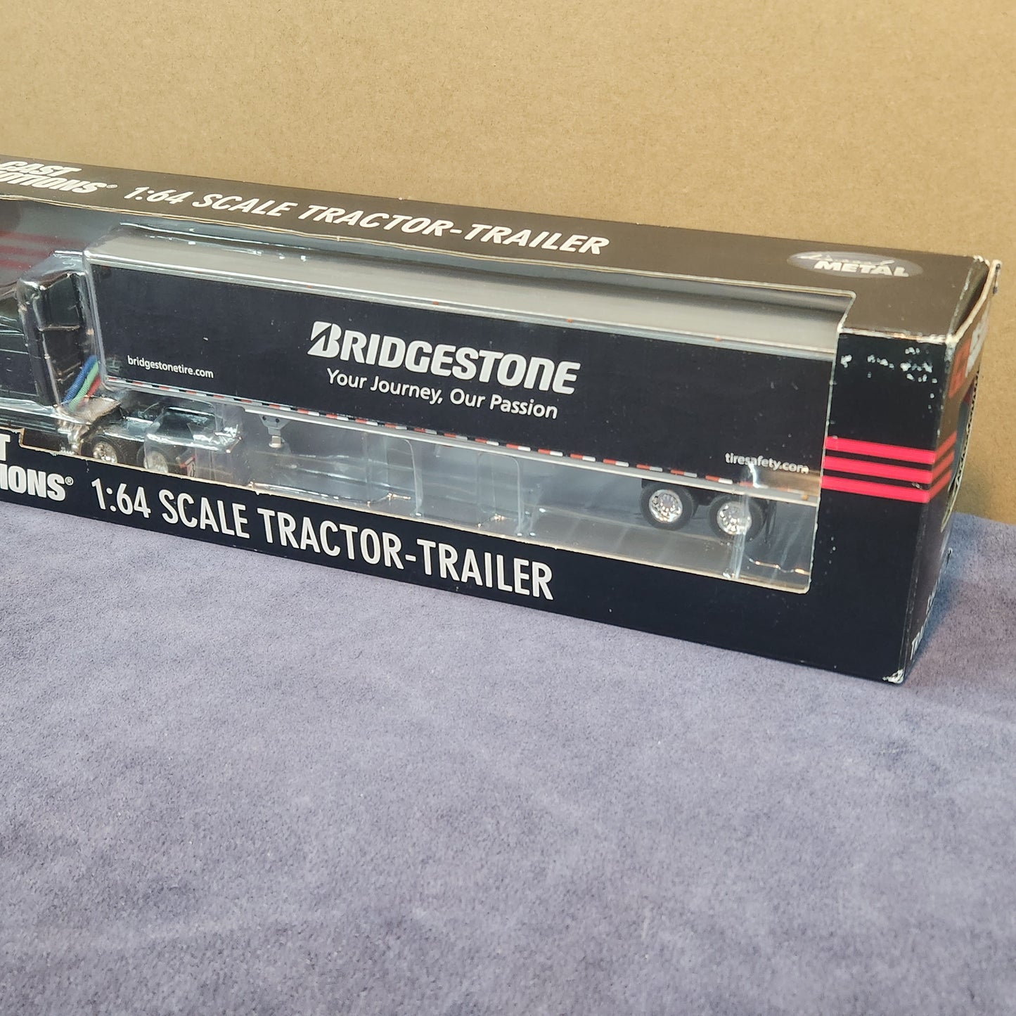 Diecast Promotions 1:64 Bridgestone Volvo VNL 630 Mid Roof with Dry Goods Trailer DCP #33658
