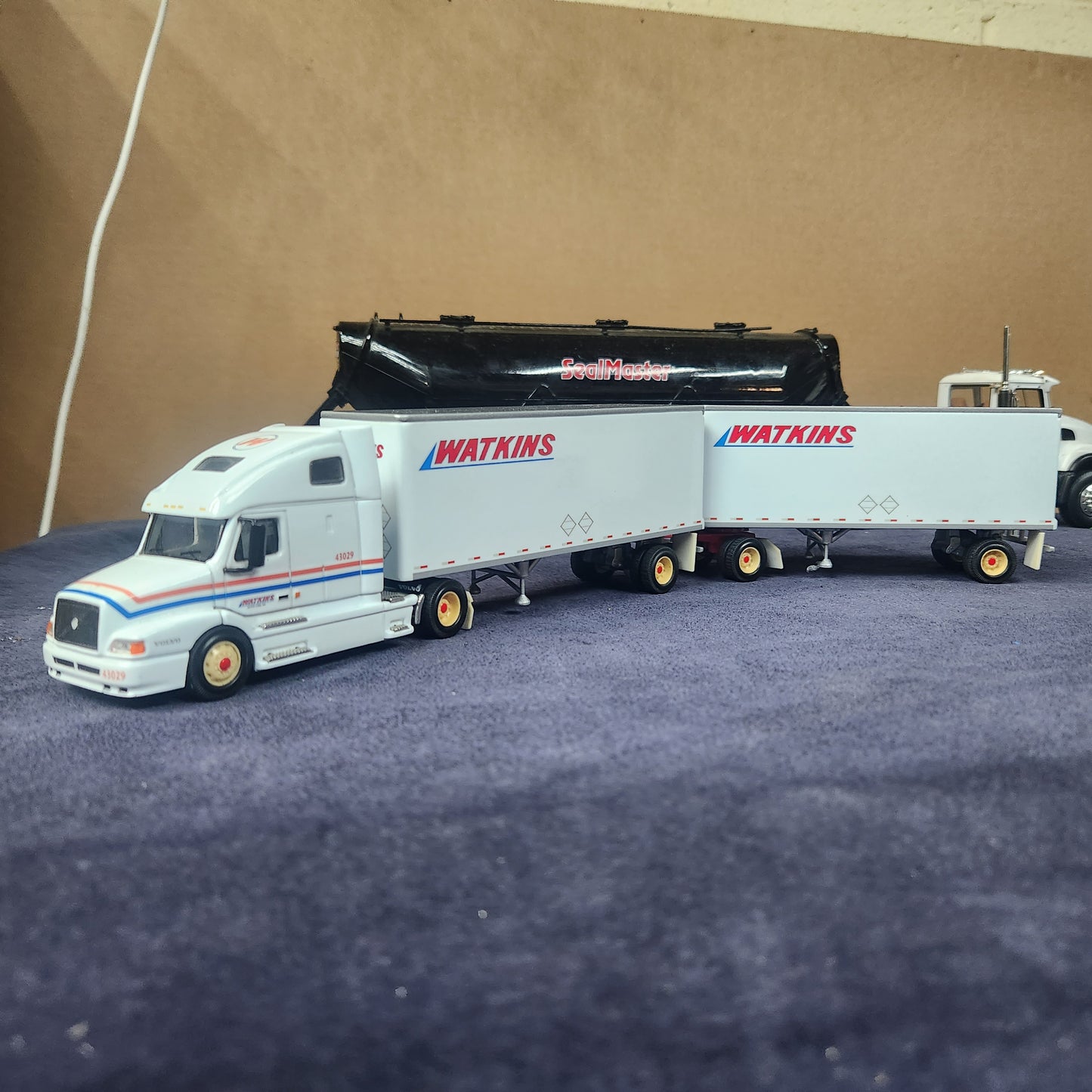 PEM 1:64 Watkins Volvo Single Axle Sleeper Tractor with Dual Pup Trailers and Dolly