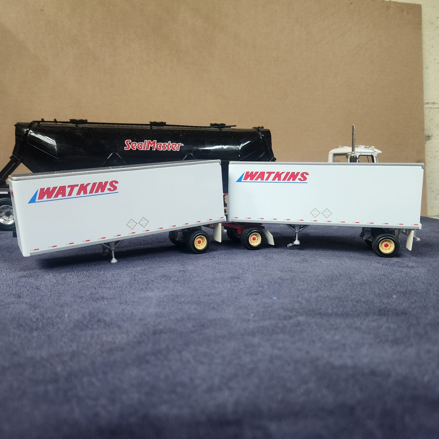 PEM 1:64 Watkins Volvo Single Axle Sleeper Tractor with Dual Pup Trailers and Dolly