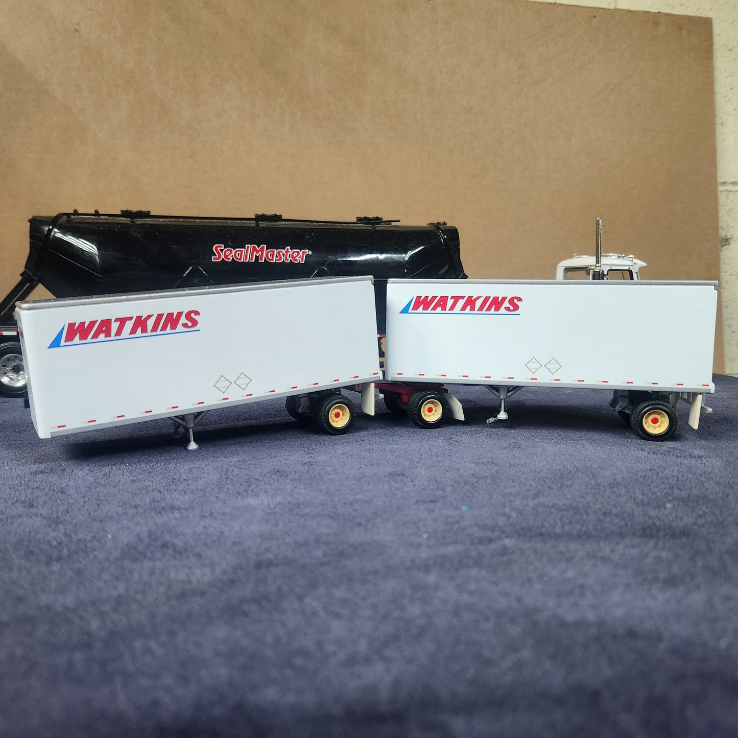 PEM 1:64 Watkins Volvo Single Axle Sleeper Tractor with Dual Pup Trailers and Dolly