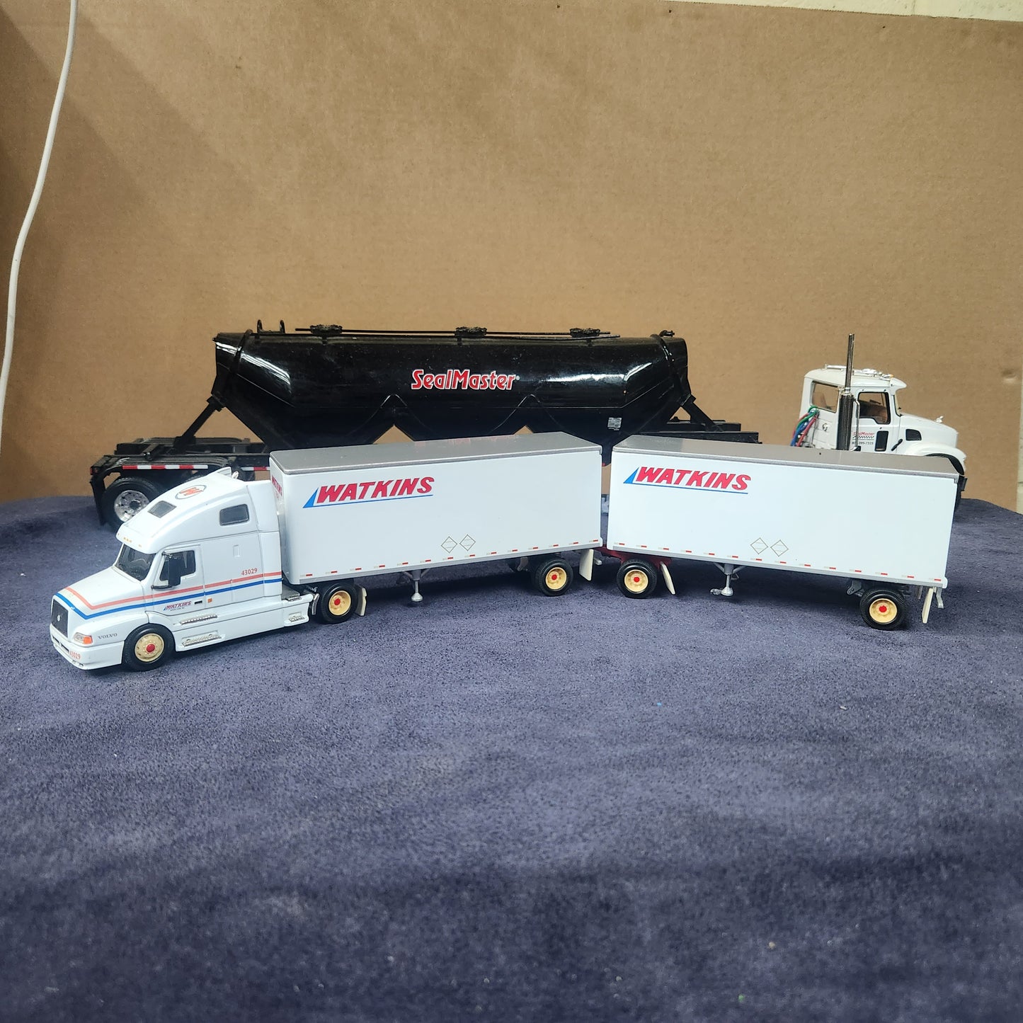 PEM 1:64 Watkins Volvo Single Axle Sleeper Tractor with Dual Pup Trailers and Dolly