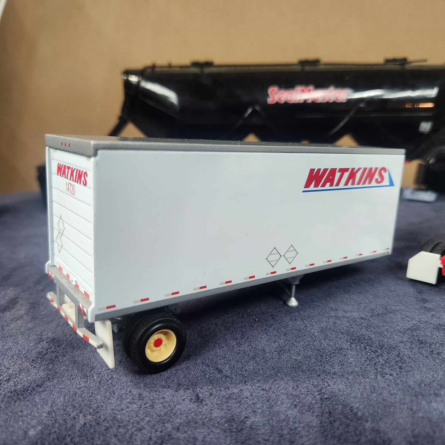 PEM 1:64 Watkins Volvo Single Axle Sleeper Tractor with Dual Pup Trailers and Dolly