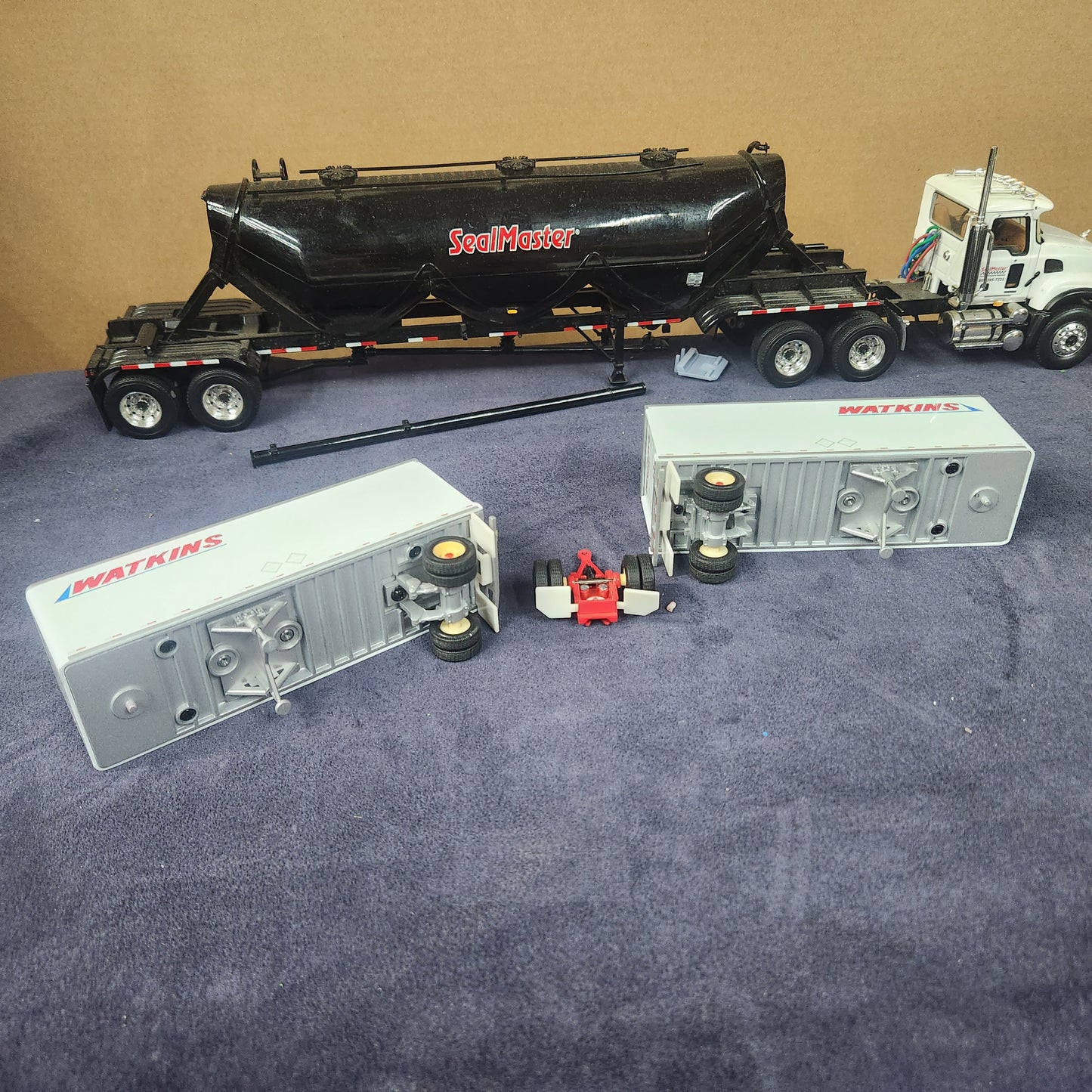 PEM 1:64 Watkins Volvo Single Axle Sleeper Tractor with Dual Pup Trailers and Dolly