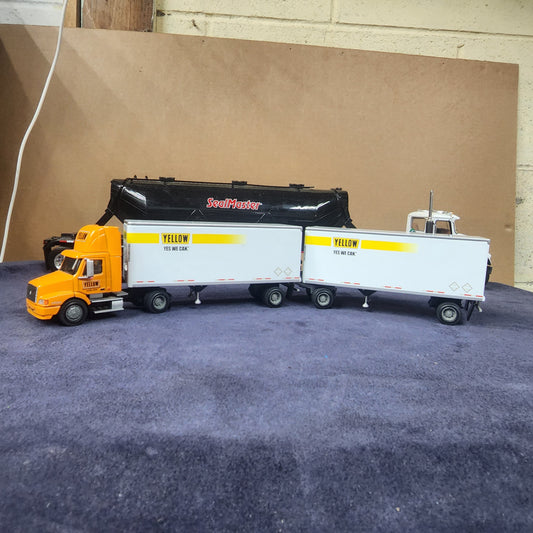 PEM 1:64 Yellow Volvo Single Axle Day-Cab Tractor with Dual Pup Trailers and Dolly